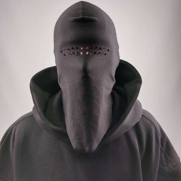 Blank black balaclava made from 100% cotton with raw edges in one size with holes.