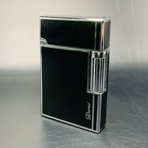 Smart Black Lighter, Refillable Butane With Side Spark ignition.