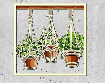 May include: Three potted plants hanging from a wooden frame against a concrete wall. The plants are in brown pots and have green leaves. The frame is painted a light yellow color.