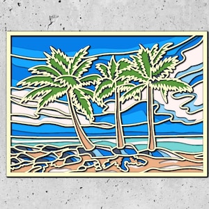 May include: A colorful paper cut art piece depicting three palm trees on a beach with a blue sky and white clouds. The art piece is framed in a light yellow frame.