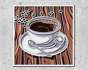 May include: A white coffee cup with brown liquid inside, sitting on a white saucer with a spoon. The cup and saucer are on a wooden surface with coffee beans scattered around.