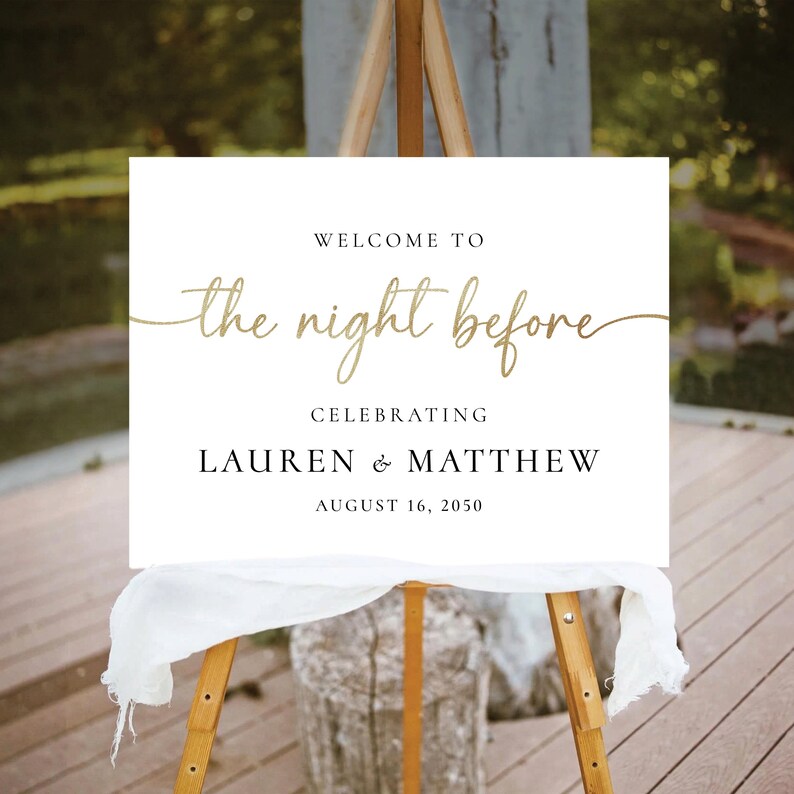 May include: White sign with black text that reads "Welcome to the night before celebrating Lauren & Matthew August 16, 2050". The sign is on a wooden easel.