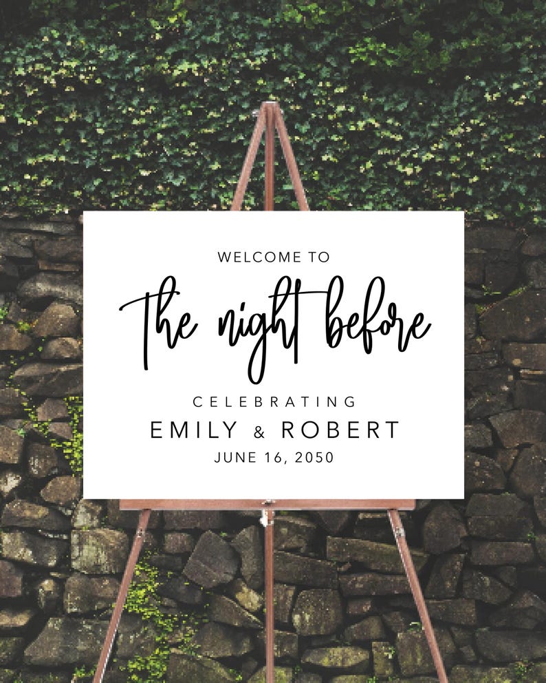 May include: White sign with black text on an easel. The sign reads "Welcome to The night before Celebrating Emily & Robert June 16, 2050".