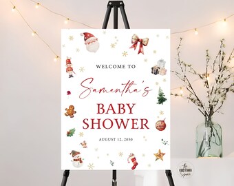 May include: White baby shower sign with red and gold Christmas decorations. The sign says "Welcome to Samantha's Baby Shower August 12, 2050".