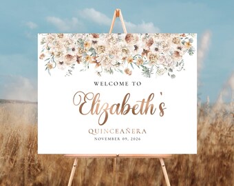 Peut inclure: Une pancarte de bienvenue à Elizabeth's Quinceañera avec un motif floral dans des tons beige, marron et blanc. Le texte indique "Bienvenue à Elizabeth's Quinceañera le 09 novembre 2026".