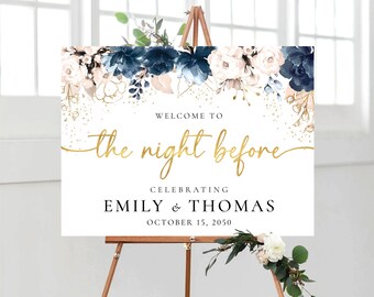 May include: Welcome to the night before sign with a floral design in shades of blue and pink with gold glitter accents. The sign reads "Welcome to the night before celebrating Emily & Thomas October 15, 2050".