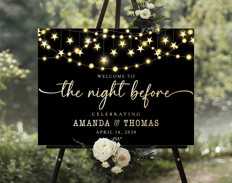 May include: Black welcome sign with gold lettering and stars. The sign reads "Welcome to the night before celebrating Amanda & Thomas April 14, 2030".