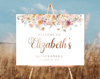 Peut inclure: Affiche de bienvenue à Elizabeth's Quinceañera avec un motif floral dans les tons rose, jaune et bleu. Le texte est en lettres dorées et indique "Bienvenue à Elizabeth's Quinceañera le 09 octobre 2026".