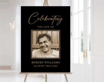 Op de afbeelding: Zwart en gouden gedenkteken met een foto van een lachende man. De tekst luidt "Celebrating the life of Robert Williams June 20, 1955 - March 15, 2022".