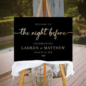 May include: Black welcome sign with gold lettering that reads "Welcome to the night before celebrating Lauren & Matthew August 16, 2050".