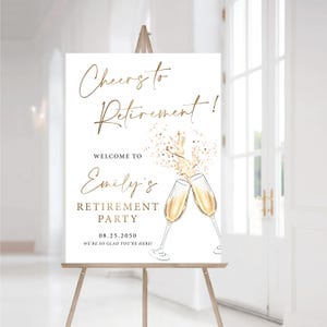 May include: A white sign on a wooden easel with gold lettering that reads "Cheers to Retirement!" and "Welcome to Emily's Retirement Party." The sign includes two champagne glasses clinking and the date 08.25.2050.