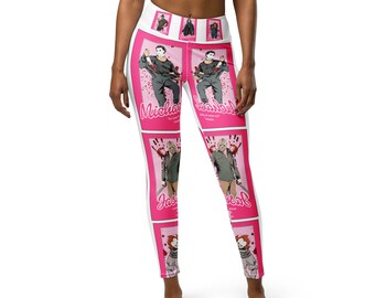 May include: White leggings with a pink and white pattern featuring horror movie characters. The leggings have a pink background with white outlines of the characters. The characters include Michael Myers, Jason Voorhees, and Freddy Krueger. The text "Michael" and "Jason" are printed on the leggings.