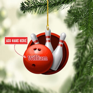 May include: Red and white bowling ball Christmas ornament with three white bowling pins. The bowling ball has the name "William" written on it.