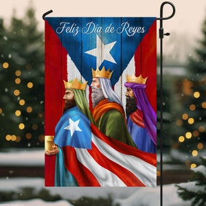 May include: A festive garden flag with a Puerto Rican flag design featuring the three wise men, a star, and the text "Feliz Dia de Reyes".