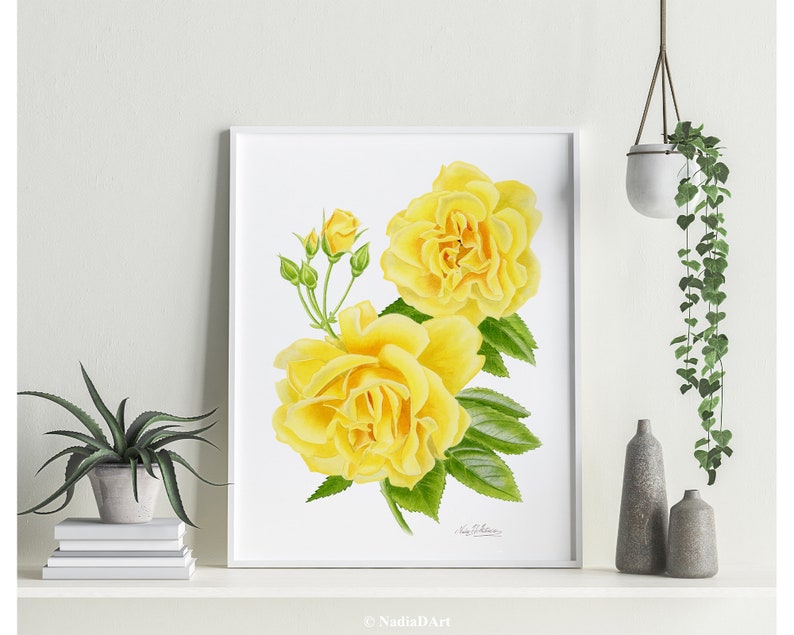May include: A watercolor painting of yellow roses with green leaves. The roses are in full bloom and have a delicate, romantic feel. The painting is framed in a white frame.