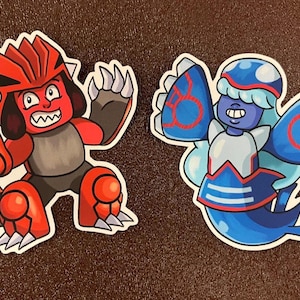 May include: Two cartoon stickers. One is a red creature with white claws and a spiky helmet. The other is a blue creature with a white and blue outfit and large blue wings. Both stickers have a white border.
