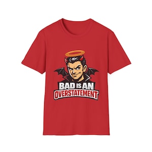 Op de afbeelding: Rood t-shirt met een cartoon duivel met een aureool en vleugels, met de tekst "BAD IS AN OVERSTATEMENT". De tekst is vetgedrukt en omlijnd, op een witte achtergrond.