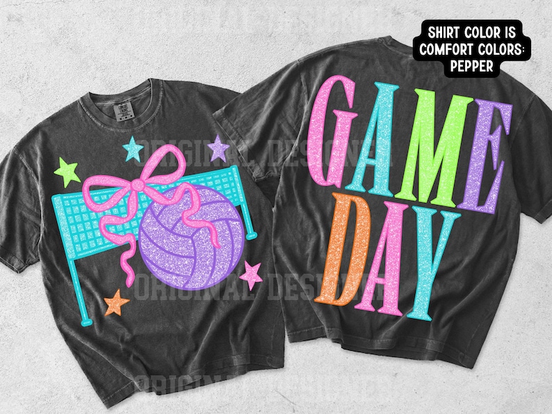 May include: Two pepper-colored t-shirts featuring a glittery graphic design. One shirt displays a volleyball, a net, and a pink bow with stars. The other shirt features the text "GAME DAY" in large, colorful, glittery letters. A label notes the shirt color is Pepper.