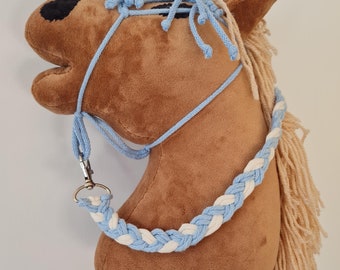 May include: A brown plush horse head with a blue and white braided rope halter. The horse has a long, blonde mane and tail.
