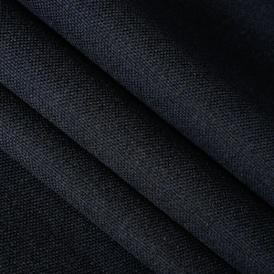 May include: Close-up of a dark blue fabric with a textured weave. The fabric is folded in a way that shows the texture and depth of the material.