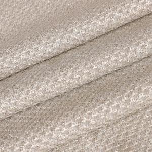 May include: Close-up of a beige fabric with a subtle shimmer. The fabric has a woven texture with a fine, repeating pattern.
