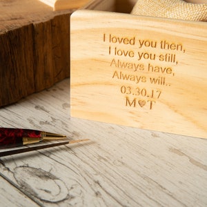 May include: A wooden box with a personalized message engraved on the front. The message reads "I loved you then, I love you still, Always have, Always will... 03.30.17 MOT".