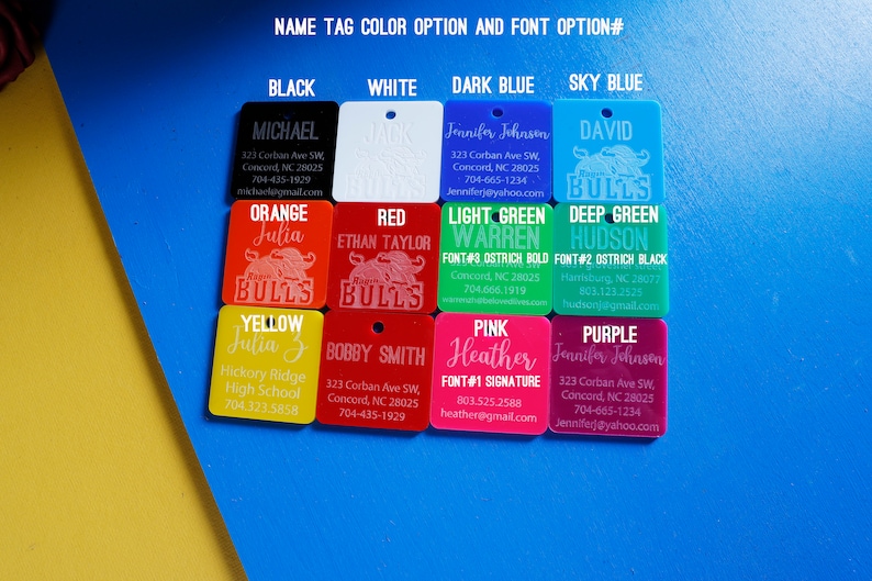 May include: A range of colour options for personalised name tags with different font styles. The tags feature a bull mascot and include contact information. The colours include black, white, orange, red, light green, deep green, yellow, pink, and purple.