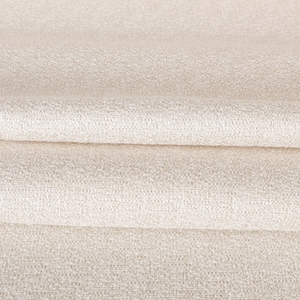 May include: Close-up of a smooth, off-white fabric with a subtle woven texture. The fabric is folded in thirds, creating soft, rounded folds.