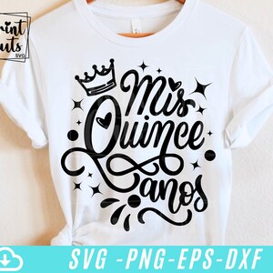 May include: White t-shirt with a black crown and the text "Mis Quince Anos" in a decorative script font.