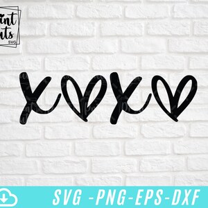 May include: Black and white graphic design of the letters "XO" with two hearts in between. The design is on a white brick wall background.