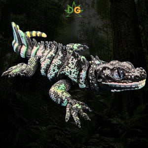 May include: An articulated lizard figurine featuring a black base color with speckled light green and yellow patterns across its textured body. The creature has a segmented tail, detailed limbs, and a prominent head with dark eyes. The letters DG appear above.