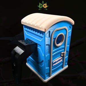 May include: A blue and beige birdhouse shaped like a portable toilet. The birdhouse has a round window and the words "BIRD-A-POTTY" printed on the door. It includes a black mounting bracket for easy installation.