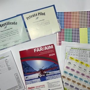 May include: A collection of aviation training materials including a private pilot certificate, a solo certificate, a FAR/AIM manual, and a set of colourful tab stickers. The FAR/AIM manual is open to a page with a photo of a small plane flying over a snowy mountain range. The text "FAR/AIM 2024" is visible on the cover of the manual.