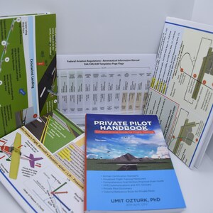 May include: A collection of aviation training materials including a blue book titled "Private Pilot Handbook: Comprehensive Guide for Flight Training" by Umit Ozturk, PhD. The book is surrounded by various charts and diagrams with illustrations of airplanes and flight patterns.