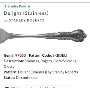 May include: A stainless steel fork from the "Delight" pattern by Stanley Roberts. The fork features a glossy finish and a floral and scroll design. The item is discontinued.
