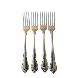 May include: A set of four silver-toned metal forks arranged vertically. Each fork features a slender handle that widens toward the base, decorated with a raised floral motif at the bottom. The tines are long and pointed, with a polished finish.