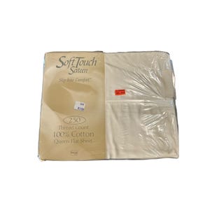 May include: A packaged queen flat sheet made of 100% cotton. The packaging is clear plastic, and the label reads "Soft Touch Sateen" with a thread count of 230. The sheet is a cream color.