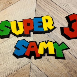 Personalized fondant super video game bros inspired name cake topper