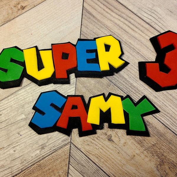 Personalized fondant super video game bros inspired name cake topper