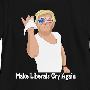 Puede incluir: Camiseta negra con una imagen de dibujos animados de un hombre con gafas de sol y una camisa blanca. El texto "Make Liberals Cry Again" está impreso debajo de la imagen.