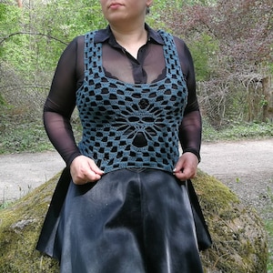 Crochet pattern and photo tutorial on how to make gothic skull cropped tank top for goth women, alt wear lovers or grunge looks