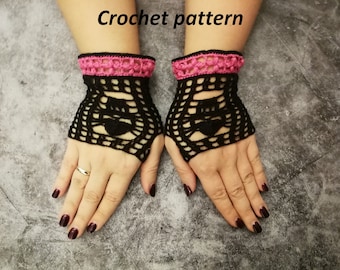 Può includere: Guanti senza dita all'uncinetto neri con rifinitura rosa al polso. I guanti presentano un motivo a forma di cuore. Il testo "Crochet pattern" è visibile nella parte superiore dell'immagine.