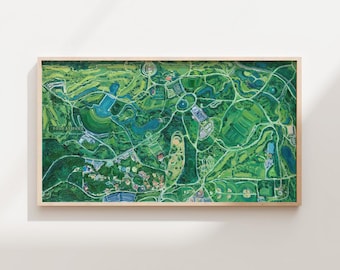May include: A framed aerial view painting of a park, showcasing a vibrant green landscape with winding paths, bodies of water, and various structures. The artwork is set within a light-colored wooden frame, creating a natural aesthetic. The painting's detailed depiction offers a sense of depth and perspective.