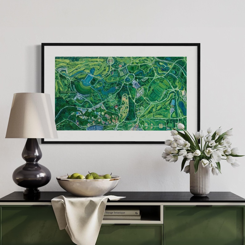 The vibrantly green and colorful Forest Park painting framed with matting on white wall in home interior setting above a green console with vase of tulips and bowl of pears.