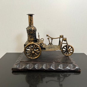 Model car on wood block