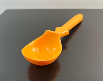 Vintage orange plastic ice cream scoop