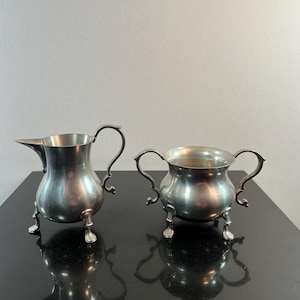 Vintage Steiff pewter creamer and sugar set