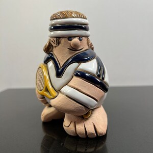 Vintage ceramic tennis player figurine