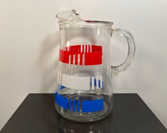 Vintage clear glass pitcher with red white and blue stripes