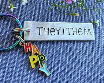 They/Them keychain on rainbow key ring with rainbow "happy" charm, pride, pronouns